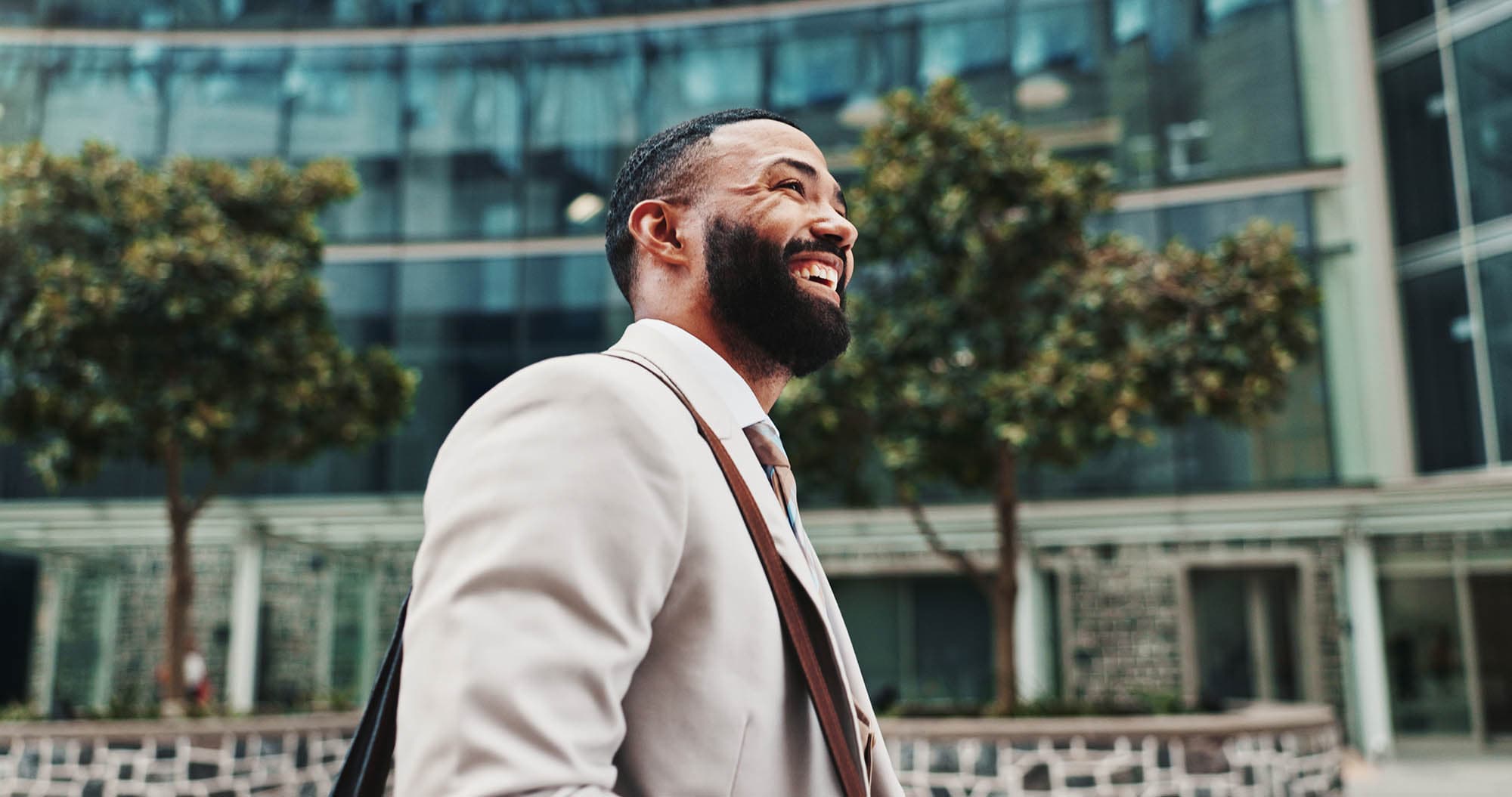 A man walking and smiling with energy